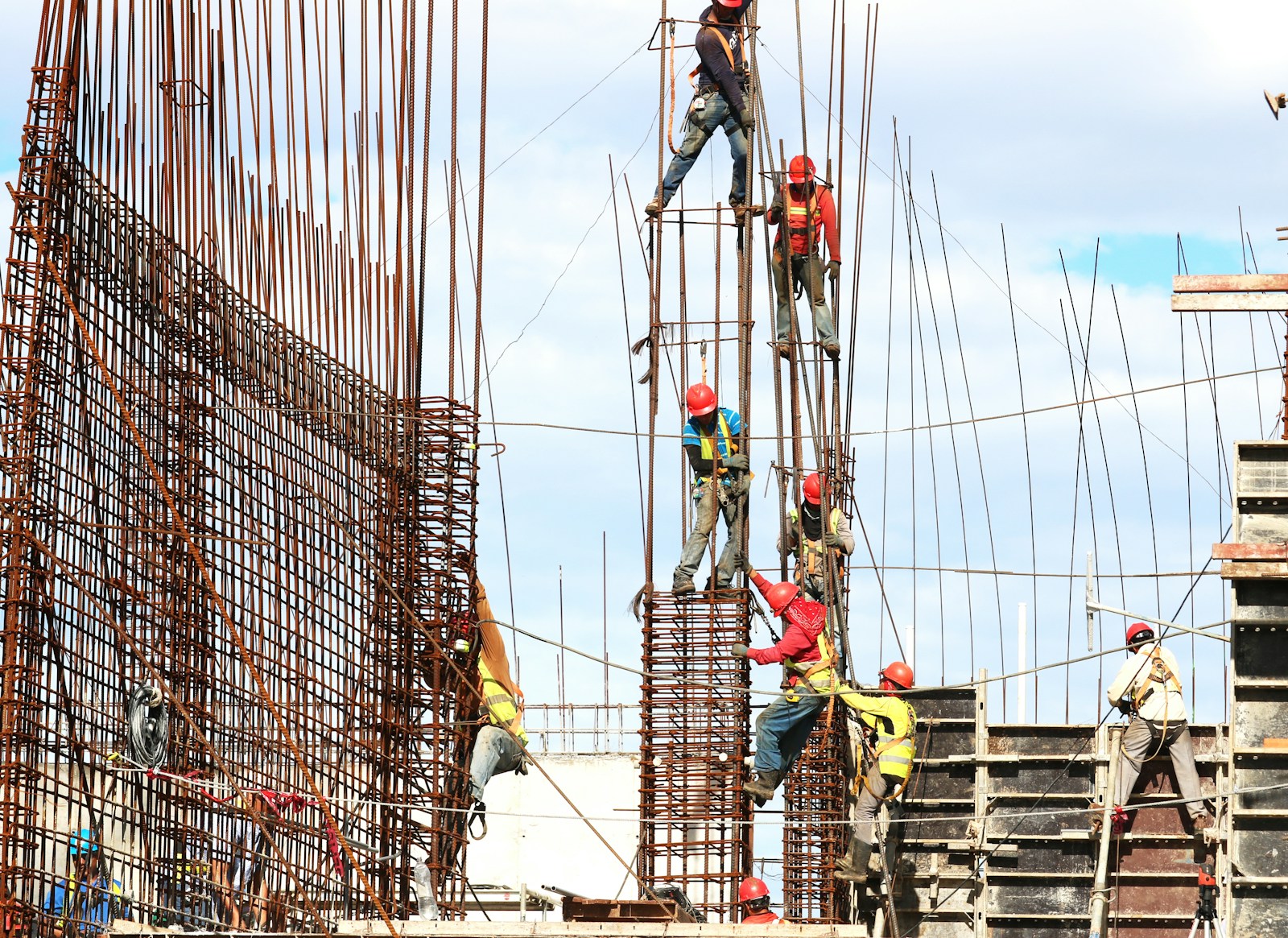 people working on building during daytime, construction